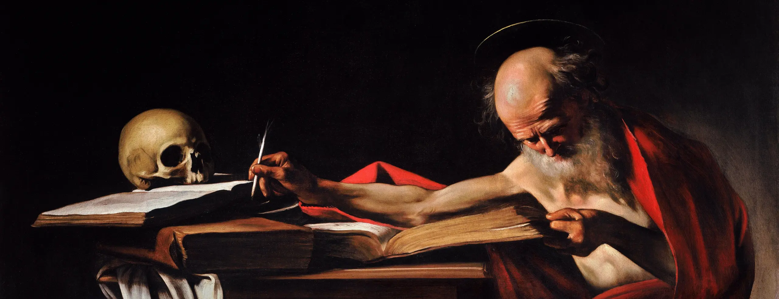 San Jerónimo, anciano de barba blanca envuelto en un manto rojo, escribe inclinado sobre un libro abierto junto a una calavera